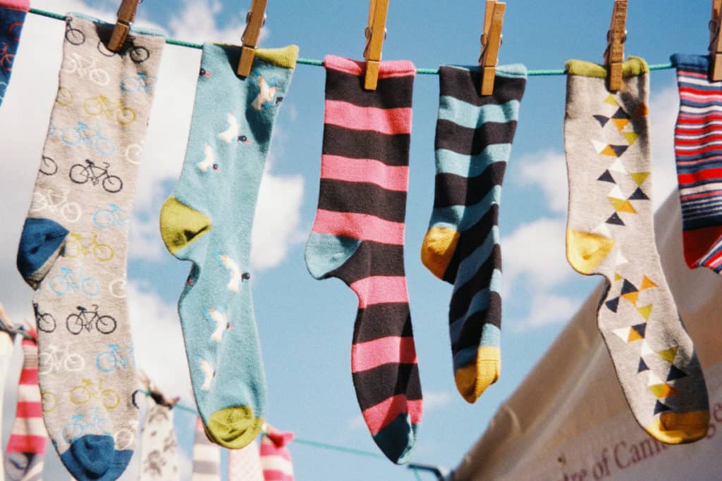 recycling old socks, socks drying on clothesline