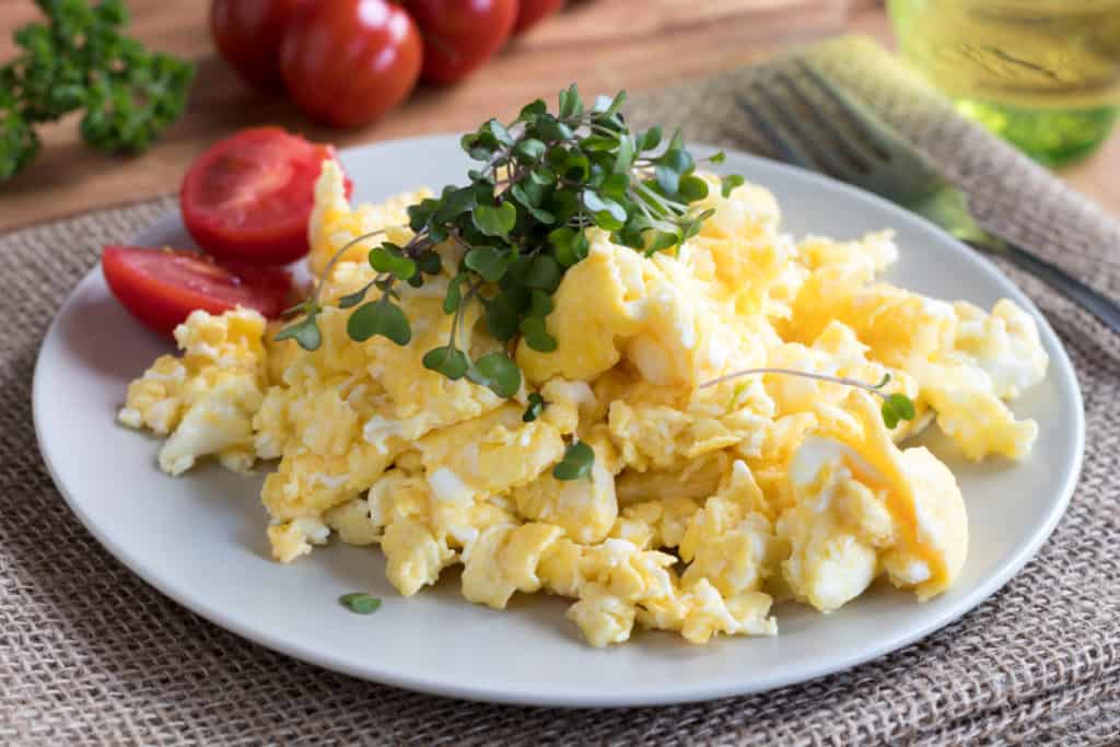 YayImages_HowDoYouEatMicrogreens_scrambled-eggs-with-fresh-microgreens-on-top