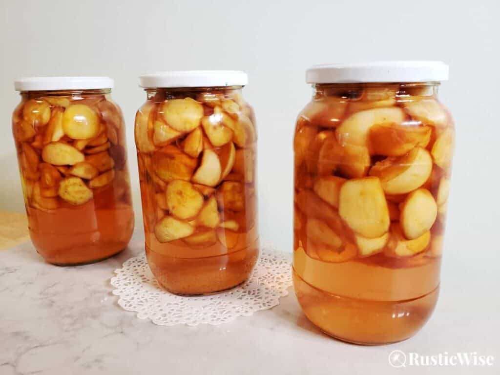 RusticWise, crab apple liqueur in glass jars